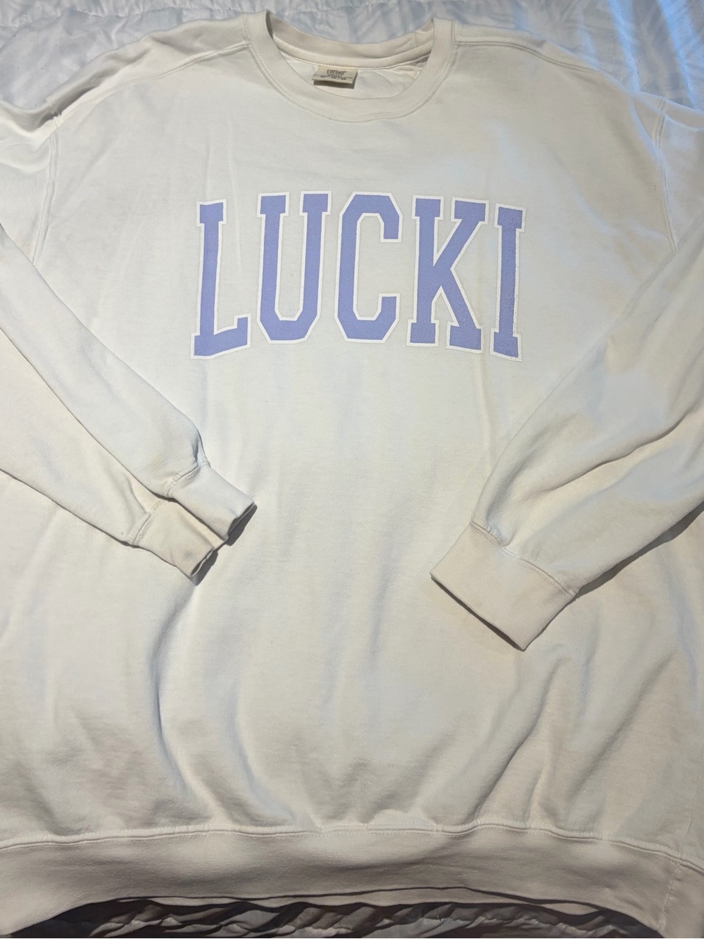 White Sweatshirt with lucki clover Lilac Lettering